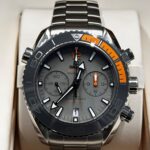 Omega watch Titanium close up of Orange and Grey Dial