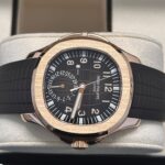 Patek Philippe Aquanaut 5164R Travel Time rose gold men’s watch with black embossed dial, dual time display, and rubber strap in original box