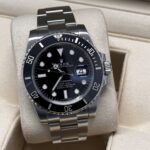 Rolex submariner date black dial close up box and papers